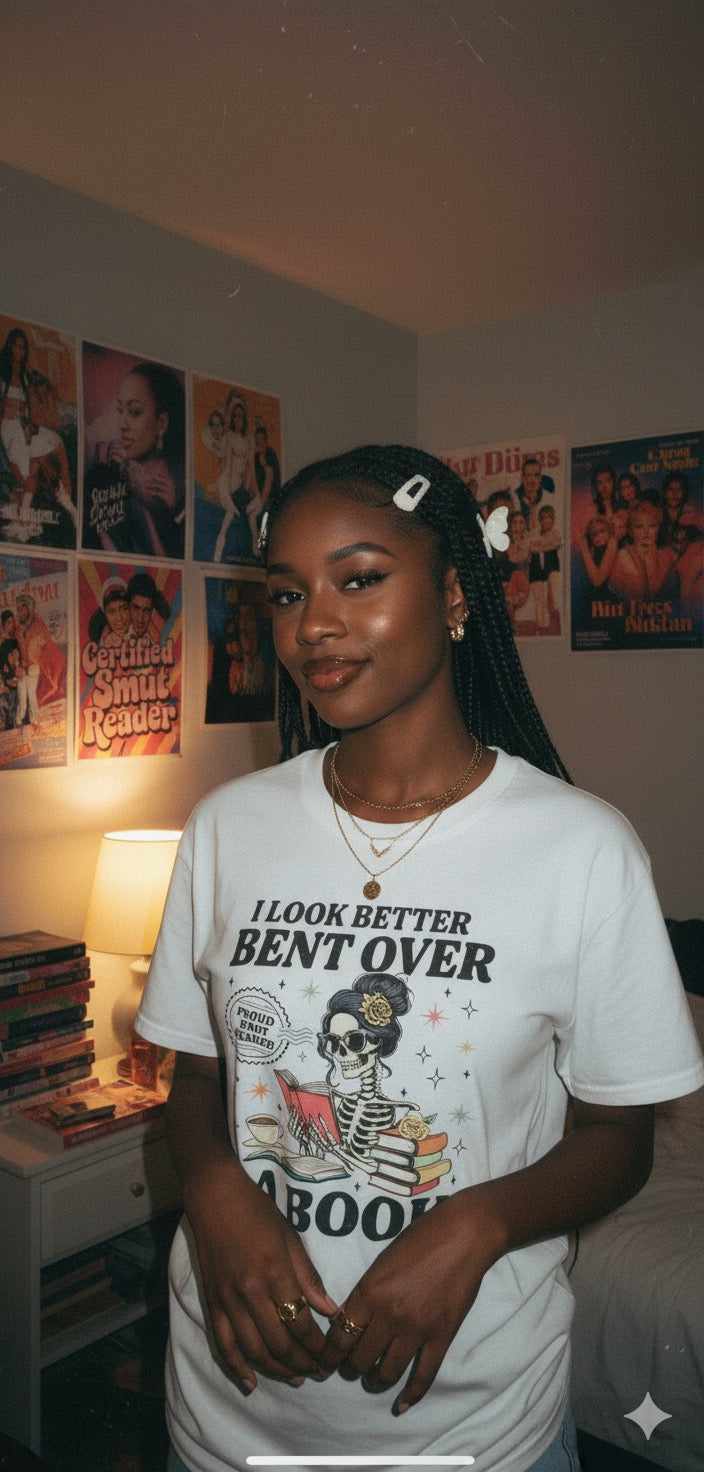“Bent Over a Book” Skeleton Tee (Black Text)