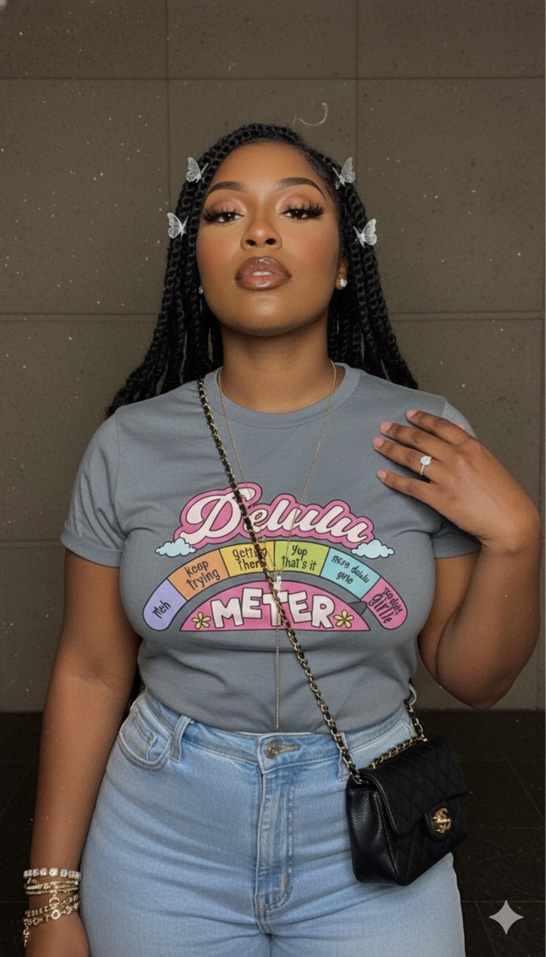 “Delulu Meter Tee – For When Reality’s Overrated”