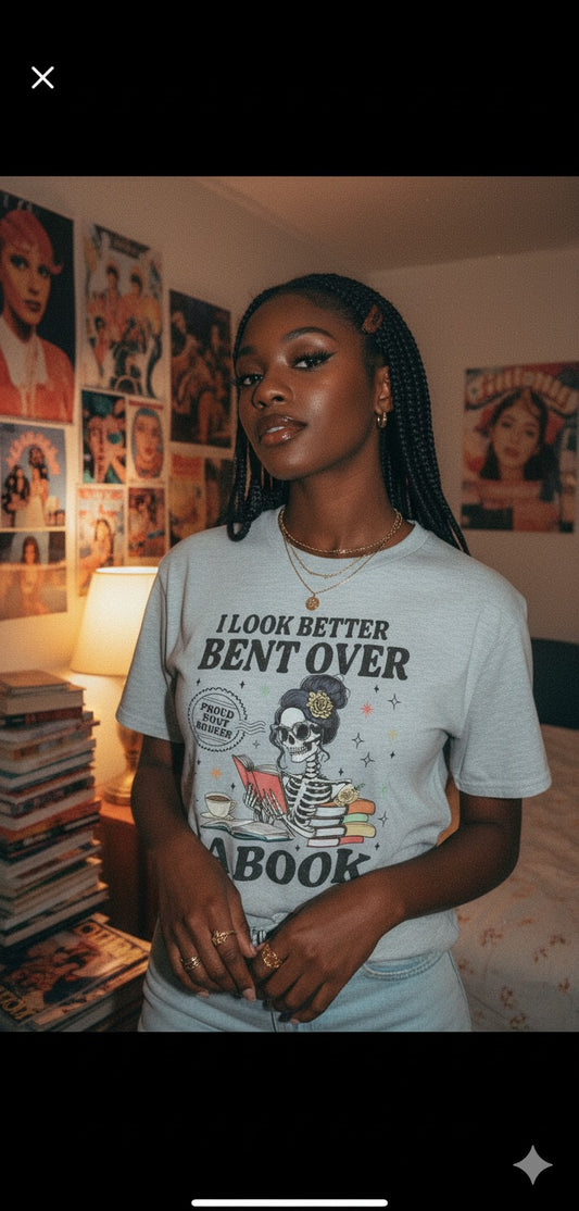 “Bent Over a Book” Skeleton Tee (Black Text)